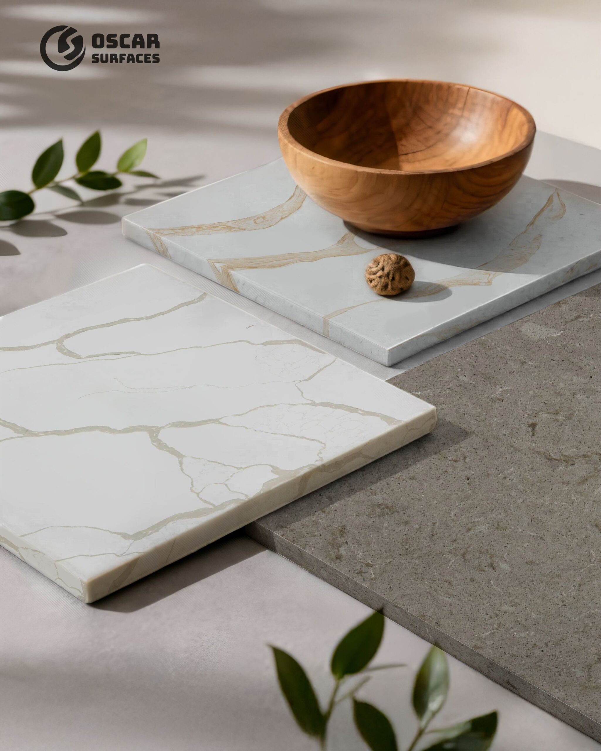 Various samples of luxury stone and quartz countertops from Oscar Surfaces, showcasing material options available for the Shoreline apartment kitchens and bathrooms.