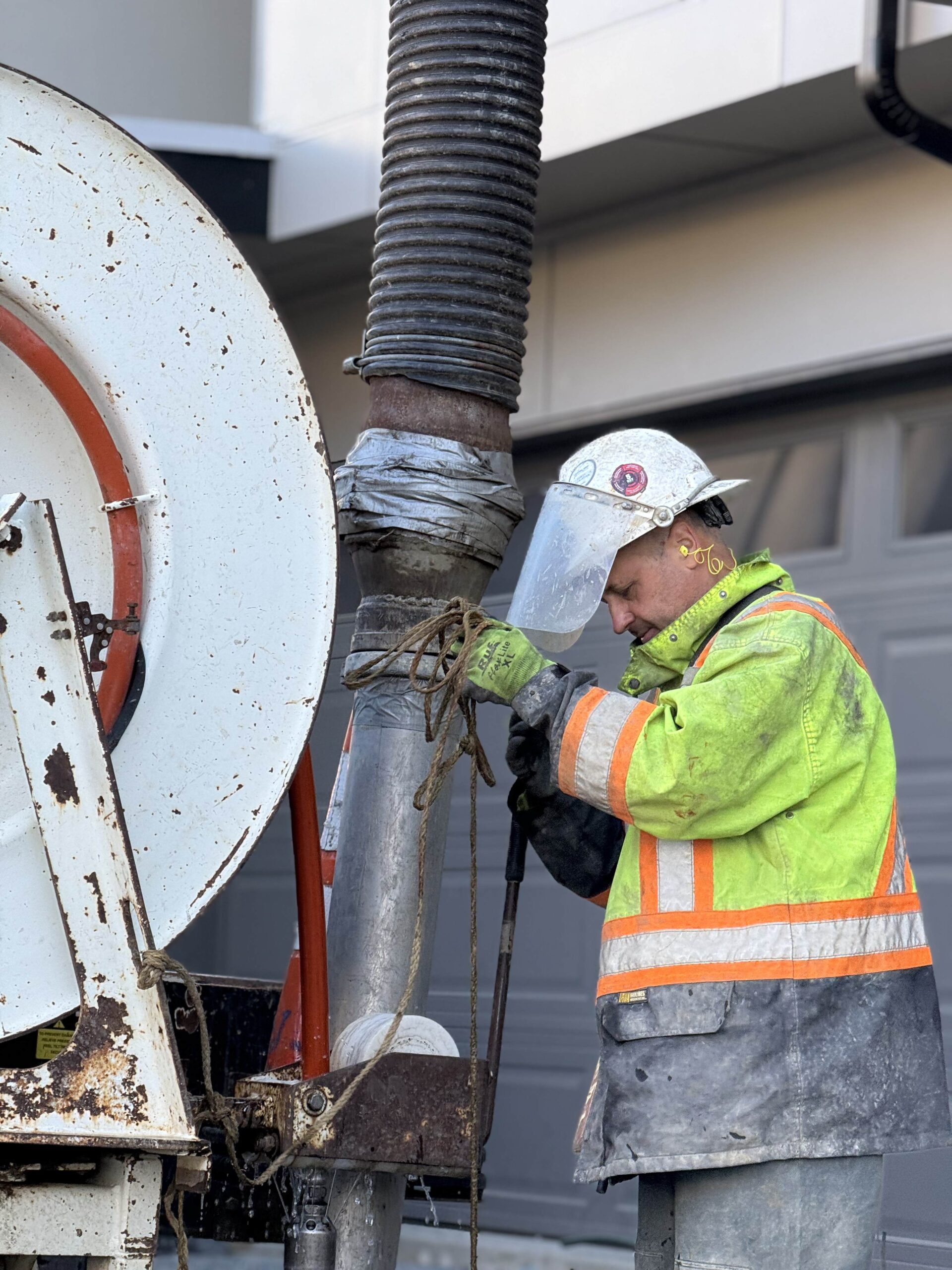 A worker in protective gear operates a specialized excavation machine, demonstrating advanced techniques used by TP Home's expert partners.